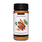 A bottle of Epicure Carne Asada marinade mix on a plain white background. The clear bottle shows the brownish-orange seasoning blend inside, topped with a black cap and featuring a white label with an illustration of sliced grilled meat and jalapeño slices.