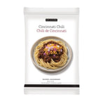 A package of Epicure Cincinnati Chili seasoning and garnish, featuring a white bag with a photo of spaghetti topped with chili and cheese on the front.