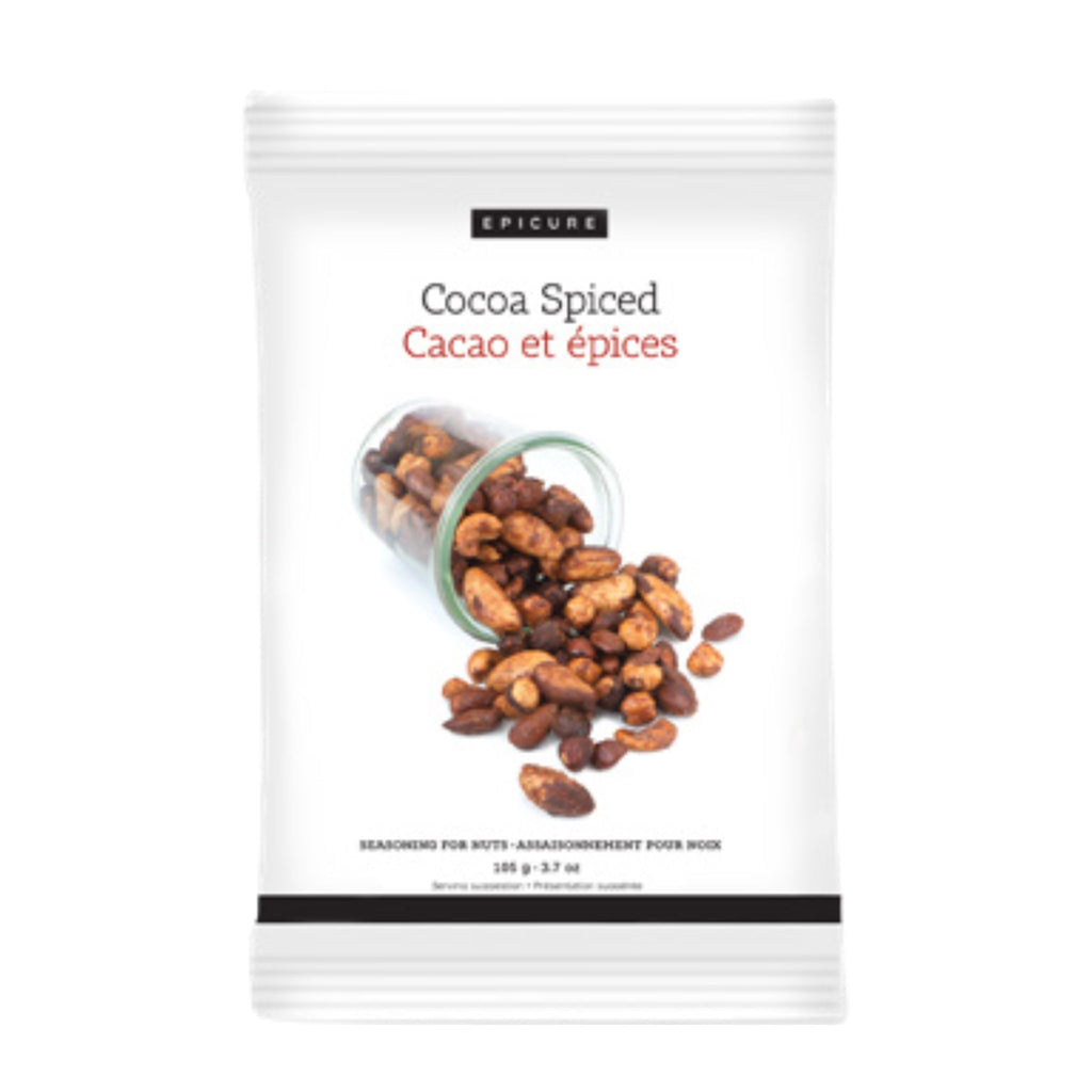 A white resealable pouch of Epicure Cocoa Spiced seasoning with a photo of cocoa beans spilling from a glass jar on the front, shown on a plain white background.