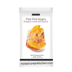A white stand-up pouch of Epicure Fizzy Pink Sangria mix, featuring a photo of an orange drink in a glass with orange slices on the front