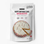 A 302 g bag of Epicure Happy Birthday Cake mix, featuring a white stand-up pouch with a photo of a frosted birthday cake with sprinkles and a slice cut out. The packaging includes text in English and French, along with icons indicating gluten-free, not too rich, and 4 servings.