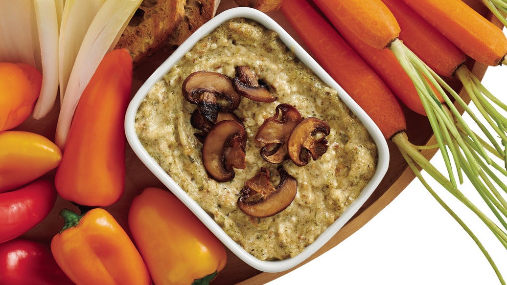 Prepared Epicure Herb & Mushroom Hot Dip Mix in a white bowl with crudites
