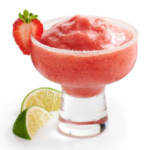 A pink strawberry margarita in a margarita glass with a salted rim, garnished with a strawberry slice on the edge, with lime wedges on a white background.