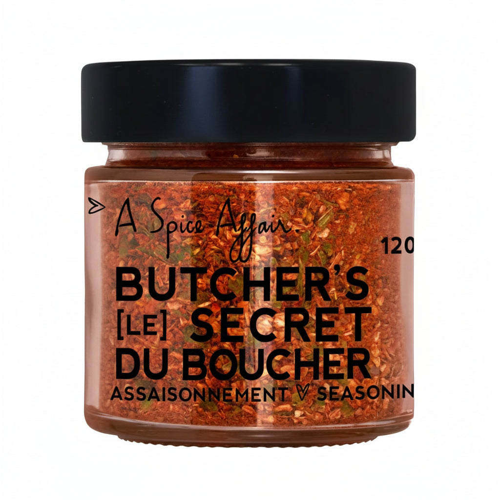 Jar of 'Butcher's Secret' seasoning with black lid on a white background