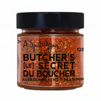 Jar of 'Butcher's Secret' seasoning with black lid on a white background