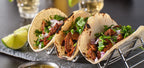 Carne Asada marinated steak slices on tortillas with garnishes