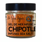 180 gm jar of A Spice Affair chipotle-infused sea salt with a black lid on a white background