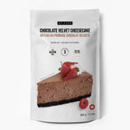 A stand-up pouch of Epicure Chocolate Velvet Cheesecake baking mix, featuring a photo of a slice of chocolate cheesecake with strawberries on the front, set against a plain white background.