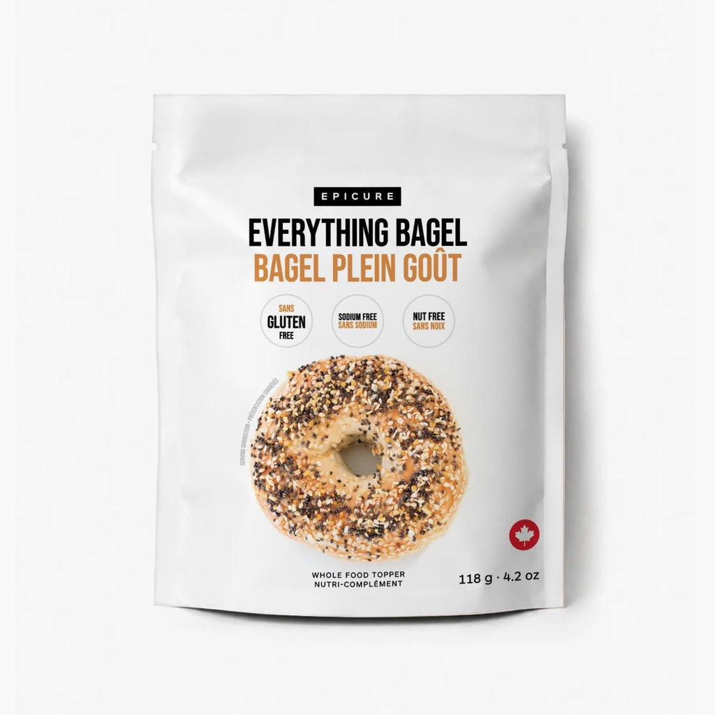 A stand-up pouch of Epicure Everything Bagel Whole Food Topper featuring a photo of a seeded bagel on the front. The packaging is white with black and orange text and includes icons for gluten free, sodium free, and nut free.