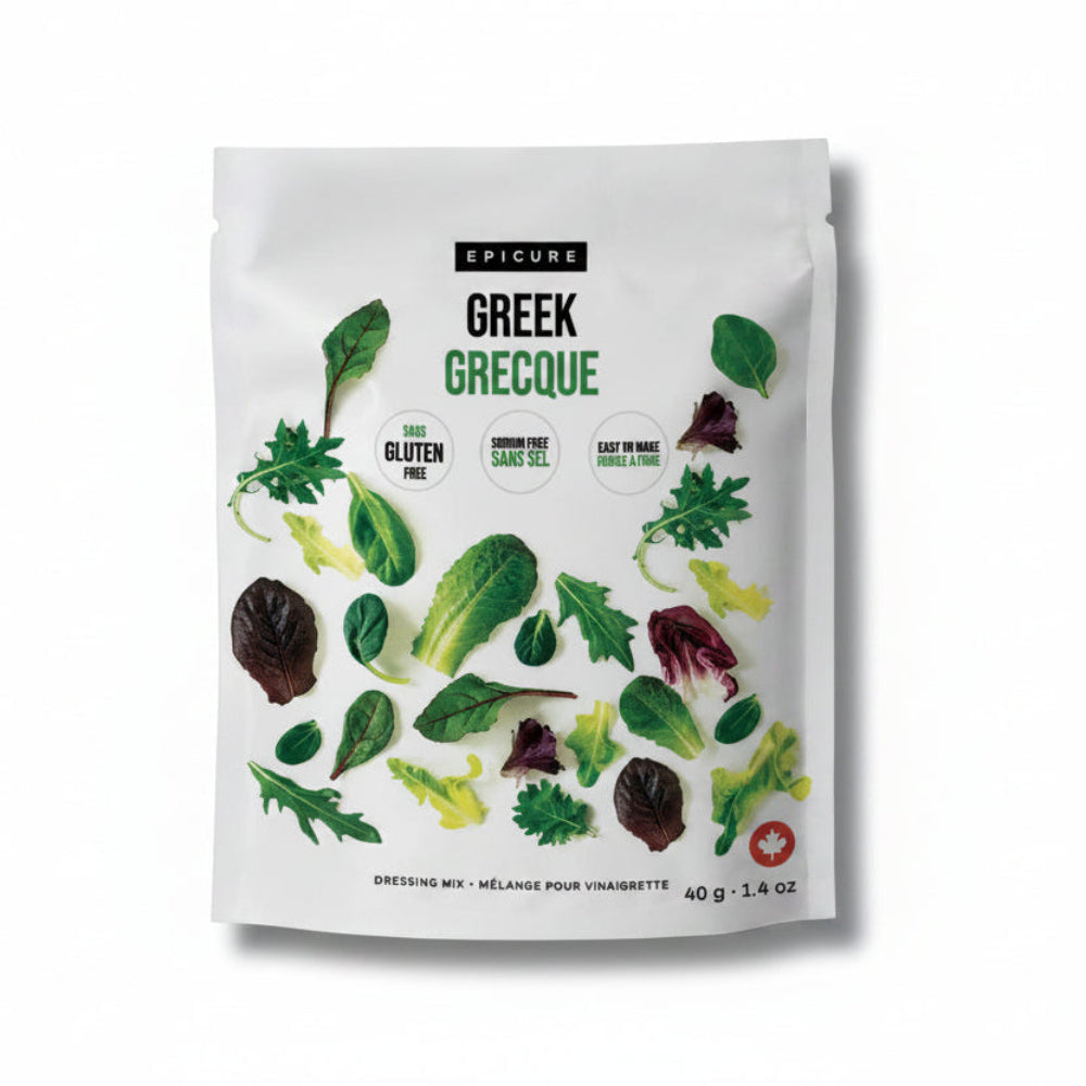 A white stand-up pouch of Epicure Greek Grecaque dressing mix, featuring illustrations of various green and red salad leaves on the front, set against a plain white background.