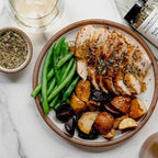Roast chicken with green beans and roasted potatoes seasoned with Herbs of provence 