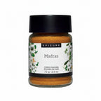 Jar of Epicure Madras Curry Powder with a black lid on a white background