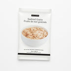 A single packet of Epicure Seafood Gratin hot dip mix, featuring a white package with a photo of the creamy, speckled prepared food in a bowl and black text.