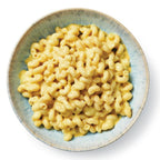 A top-down view of Epicure Modern Mac served in a light blue ceramic bowl on a white background.