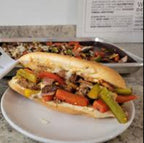 Philly Cheesecake sandwich with vegetables on a plate 