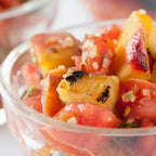 Poco Picante Salsa Mix served as chunky salsa with grilled fruit and vegetables tomatoes herbs and toasted seasoning in a clear glass bowl