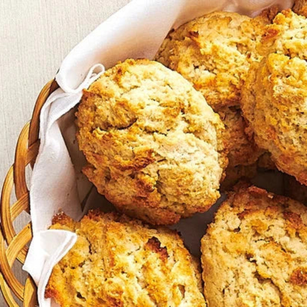 Basket of golden brown Quick Biscuit biscuits in a wicker basket lined with a white napkin