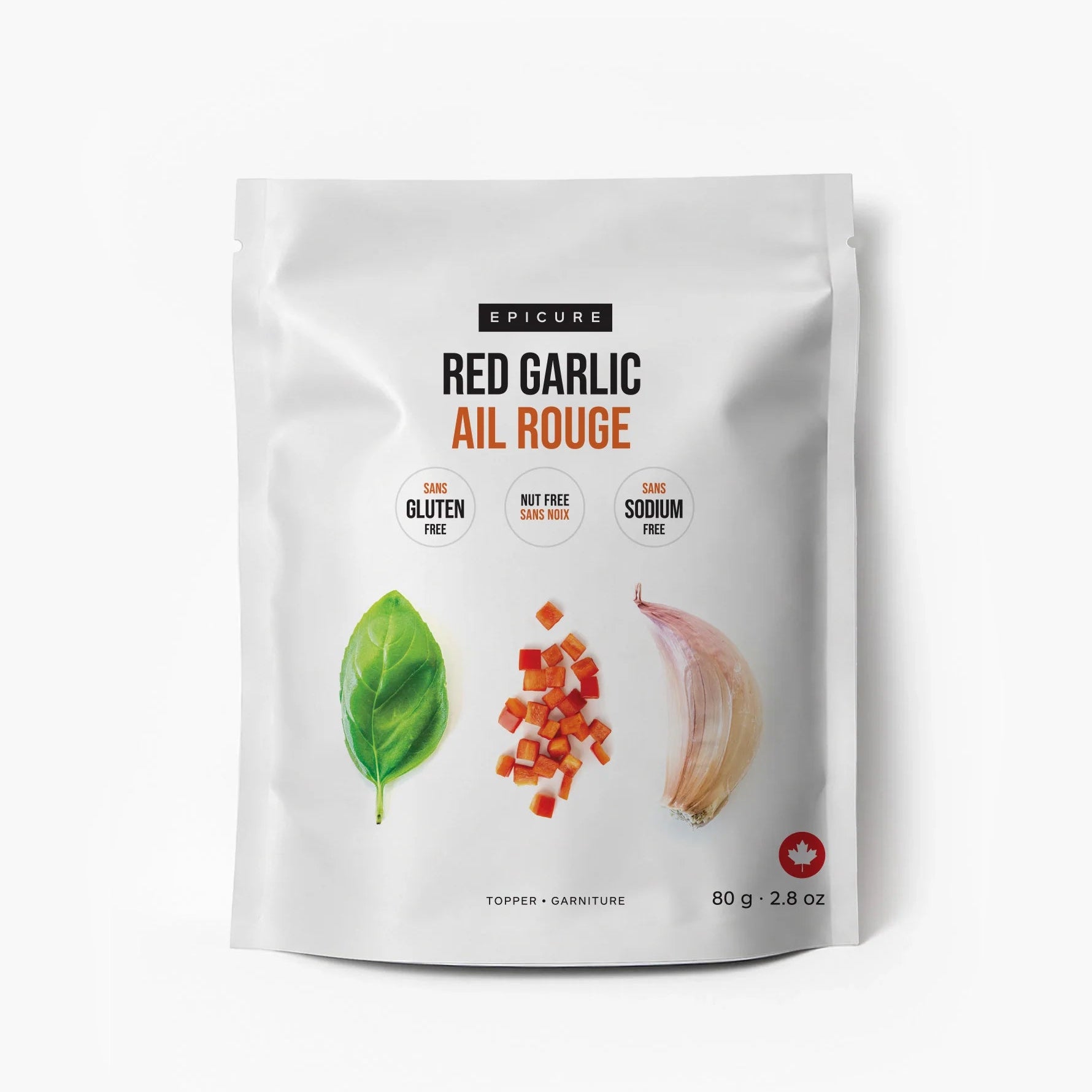 A white stand-up pouch of Epicure Red Garlic Ail Rouge seasoning, featuring illustrations of a green basil leaf, diced red garlic, and a garlic bulb on a clean white background.