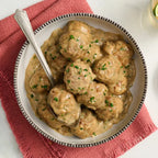 Bowl of Swedish Meatball Epicure with gravy on a red cloth