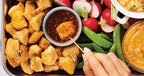Platter of fried chicken chunks with Sweet Chili Sauce by Epicure, radishes, and snap peas.